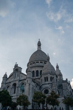 Vertical low angle shot of the historic Basilica of Montmartre, Paris, France