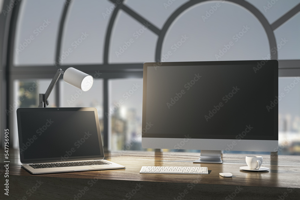 Aufkleber Close up of night designer desktop with empty laptop computer screens, coffee cup and keyboard on wooden desktop and window with city view background. Mock up, 3D Rendering.