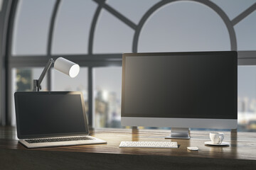 Fototapeta premium Close up of night designer desktop with empty laptop computer screens, coffee cup and keyboard on wooden desktop and window with city view background. Mock up, 3D Rendering.