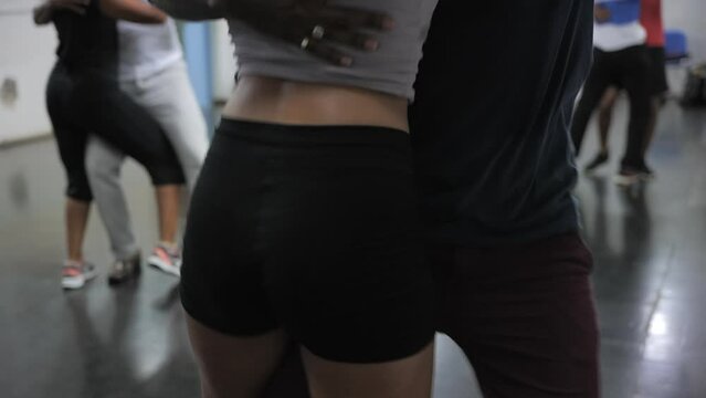 Dancers couple at Caribbean dance class