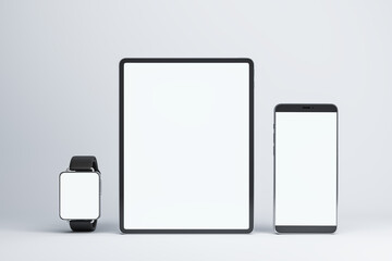 Front view on blank white modern devices screens with space for your logo or text, smart watches, digital tablet and smartphone on light background. 3D rendering, mockup