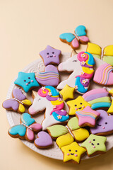 Fototapeta na wymiar Cookies of different shapes in colored glaze