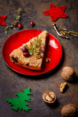 A piece of grated nut cake in a Christmas decoration