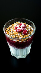 Smoothies. Fruit dissert with nuts and cherries in a glass cup. Milk and fruit smoothie with nuts and cherries.