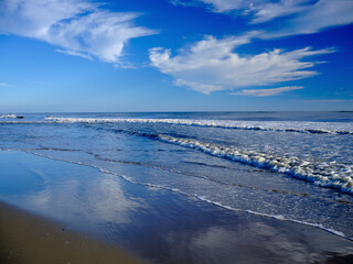 Cloud reflections in the wet sands of the Kill Devil Hills area of the Outer Banks in North Carolina