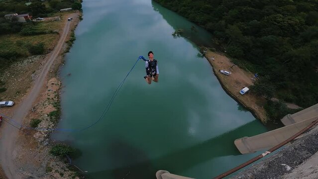double backflip bridge jump, crazy high jump, mountain bridge jump, crazy stunt, extreme jump
