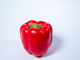 Red paprika on a white background. Red fresh pepper.