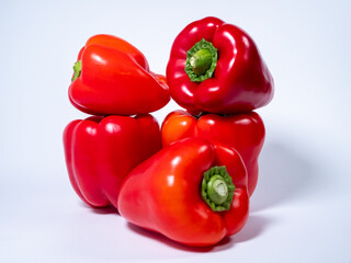 Red paprika on a white background. Red fresh pepper.