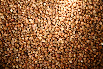 Many bulked - grains of buckwheat groats - top view - close-up