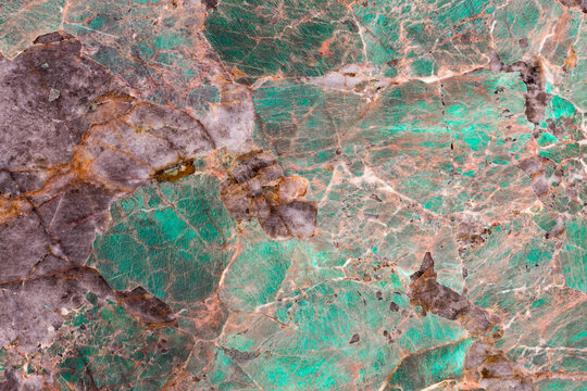 Amazonite texture. Natural patterns and textures of slice of minerals for background. Polished slab of the mineral amazonite sometimes called Amazon stone. Gem, precious stone surfaces as pattern.
