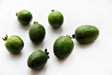 Green feijoa fruits close-up on a white background. Beautiful feijoa fruits.