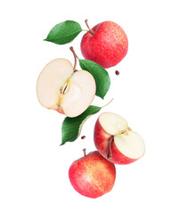 Whole and sliced ​​ripe apples with leaves in the air closeup