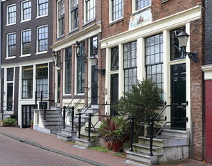 Fototapeta na wymiar Amsterdam Prinsengracht Canal Street View with House Entrance Steps, Netherlands