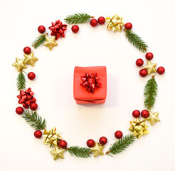 Christmas tree branches, red balls and stars, New Year's decor on a white background. Christmas frame for your text