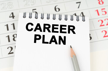 On the calendar is a notebook with the inscription - Career Plan