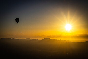 hot air balloon over Marrakech, morocco, north africa, sunrise, high atlas mountains, adventure, starburst