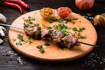 Pork neck barbecue, onion with tkemali and satsibeli sauces.