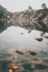 Lake on top of the Preikestolen mountain in Norway during autumn