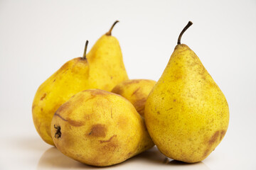 Rotten yellow pears isolated on a white