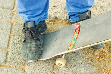 Close-up shot of a person's foot on a skateboard