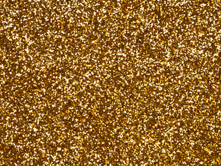 Dark gold glitter. Perfect holographic background or pattern of sparkling shiny glitter for decoration and design of Christmas, New Year, Valentine Day, xmas gift card, 3d or other holiday pictures.