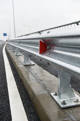 Brand new metallic road barrier for traffic safety on a new constructed road
