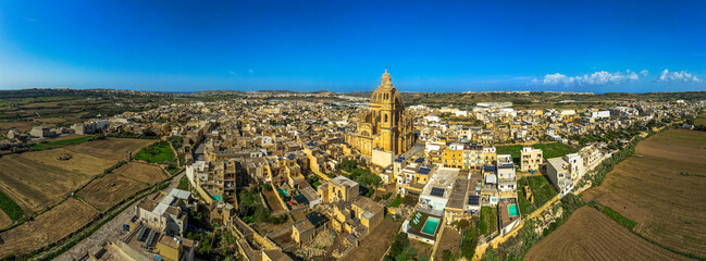 Panoramic view of Rotunda St. John Baptist Church in the town of Xewkija, Gozo, Malta. Aerial drone view