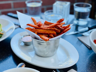 A Basket Of Yam Fried Serve With Sour Mayo
