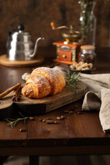 Homemade croissant on wood table and coffee time break concept