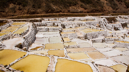 Close up of Maras Salt Mines ponds in Cusco Urubamba