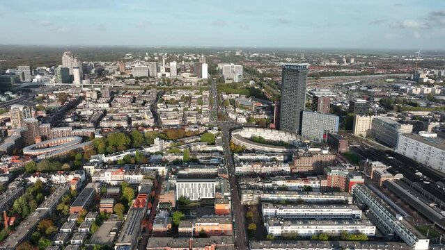 Den Haag Holland Spoort train station, Rode Dorp, China town, Stationsbuurt, Rivierenbuurt and skyline of the Hague in The Netherlands, south Holland. Aerial drone view.