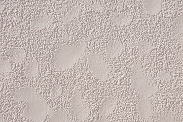 Textured patterns closeup of wall cream color