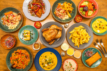 Set of colorful Peruvian gastronomy recipes with Sunday roast chicken, lots of home fries, tamale with red onion, seafood rice, lomo saltado, various ceviches and salads