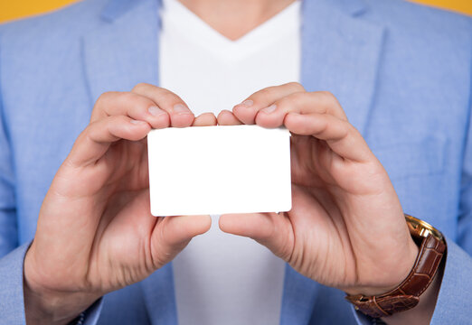 closeup of business card. hold business card in hand. holding business card with copy space.