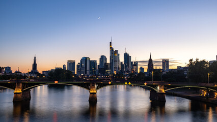 Fototapeta na wymiar Frankfurt am Main city skyline Blue Hour flat river