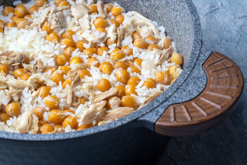 Traditional delicious Turkish food; Rice with chickpeas and chicken (Turkish name; Tavuklu nohutlu pilav or pilaf)