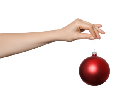 Red Bauble, christmas ball in a woman's hand, isolated
