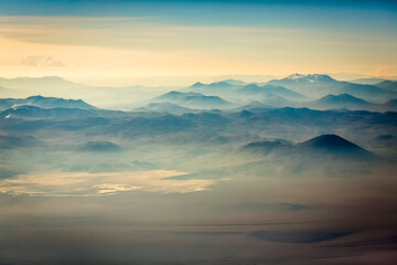 Aerial Atacama desert, snowcapped volcanoes and arid landscape in Chile