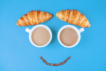 Cups of fresh hot coffee on a blue background