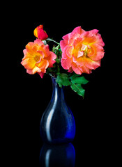 A vase of roses.