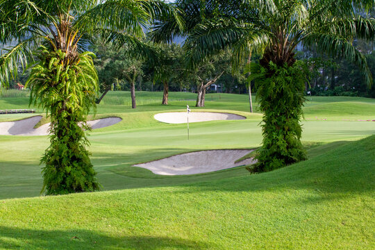 Lush golf fairways and greens in a tropical setting