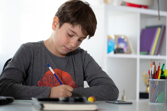 student kid studying at classroom - Powered by Adobe