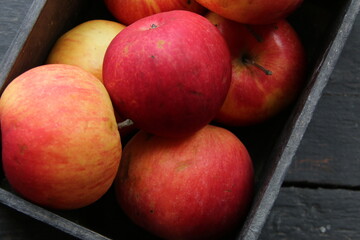 Ripe juicy apples in a vintage crate