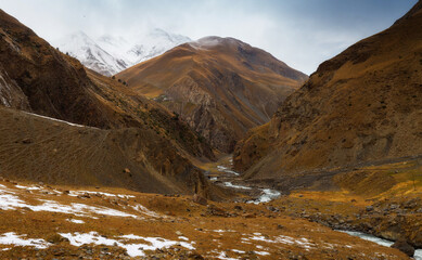Beautiful panoramic view of the gorge. Autumn mountain landscape. Oysor river in Dagestan, Russia. Valley in Chirkhalyu or Chvakhilo waterfalls. Majestic mountain peaks.