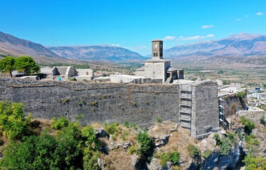 Fototapeta premium Gjirokaster Castle. Gjirokastra. Albania. View of the fortress from above. View of the city from above. White buildings in the center of the Gyrocastra. Drone shooting