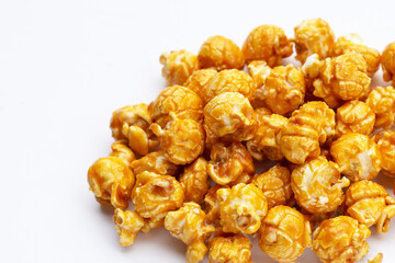 Honey caramel popcorn on white background.
