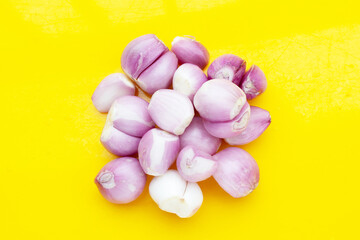 Fresh shallot on yellow background