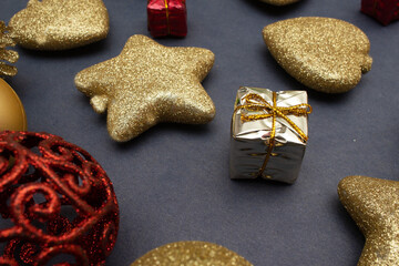 several  golden christmas ornaments on blue  background
