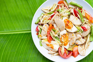 Spicy papaya salad with salted egg and vietnamese pork sausage