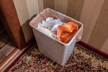 Domestic household waste bin full of kitchen waste